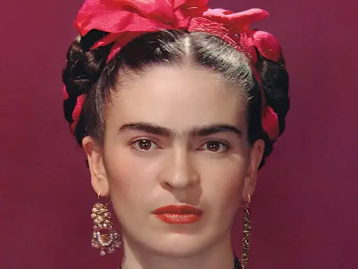 cropped version of the famous photograph titled "Frida Kahlo in Blue Dress" taken by Nickolas Muray in New York City, 1939. (cropped, so blue dress is actually out of frame)