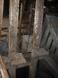 A photo of a Man Engine, showing the vertical wooden beams with the foot platforms.